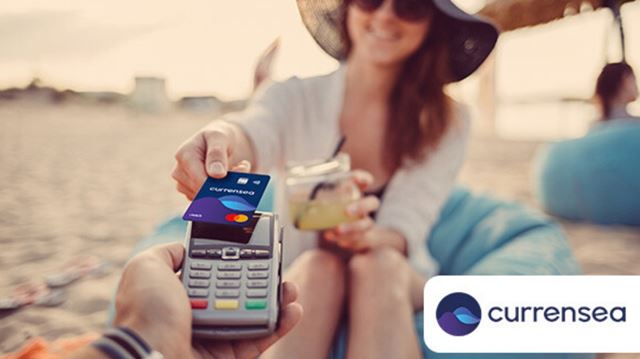 woman making a purchase on the beach